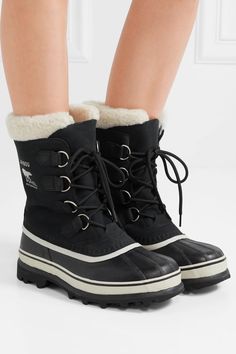 SOREL's 'Caribou' boots were designed with cold, inclement weather in mind. Made from waterproof nubuck, this pair is fully lined with removable felt and set on vulcanized rubber platforms that are seam-sealed to ensure no snow or rain will leak in. The faux shearling cuffs not only add extra warmth, but ensure a close, cozy fit too. Leather Boots For Cold Weather, Cold Weather Insulated Gore-tex Boots, Insulated Gore-tex Boots For Cold Weather, Gore-tex Waterproof Boots For Winter Cold Weather, Gore-tex Waterproof Boots For Cold Weather, Winter Gore-tex Waterproof Boots For Cold Weather, Winter Boots With Reinforced Heel, Waterproof Shearling Boots With Round Toe, Winter Ankle Boots For Outdoor Work