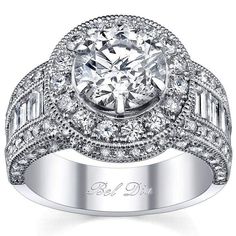 a diamond engagement ring with an oval center surrounded by baguetts and round brilliant cut diamonds