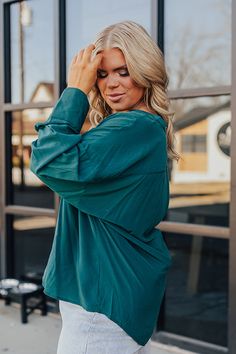 Keep it simple yet stylish in our plus size hunter green colored 'Balcony Nights Shift Top' featuring lightweight material, a button up bodice with a v-cut neckline, long loose sleeves with wide cuffs, and a relaxed silhouette that ends in a rounded hemline! Measurements 1XL : Bust 50", Hip 52", Length 26.5", Sleeve Length 18", Waist 51". 2XL : Bust 52", Hip 54", Length 27", Sleeve Length 18", Waist 53". 3XL : Bust 54", Hip 56", Length 28", Sleeve Length 19", Waist 55". Loose Sleeves, Night Shift, Wide Cuff, V Cut, V Cuts, Women Clothing Boutique, Keep It Simple, Hunter Green, Hip Length