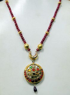 "Vintage 22 K solid gold genuine Uncut Diamond set pendant strung with Natural Ruby beads Necklace. Length-50 cm(19.69\")free size ,easy to adjust length by adjusting the toggle), size of pendant-7.5/3.5 cm, weight-38 grams.,Material-22 K gold, Uncut genuine Diamonds (polki), Ruby beads." Gold Necklace With Meenakari Round Pendant, Gold Meenakari Round Pendant Necklace, Gold Meenakari Necklace With Round Pendant, Festive 22k Gold Locket Necklace, 22k Gold Round Pendant Necklace For Festive Occasions, 22k Gold Locket Necklace In Temple Jewelry Style, 22k Gold Necklace With Round Pendant For Festive Occasions, Festive 22k Gold Necklace With Round Pendant, 22k Gold Locket Temple Necklace