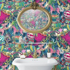 a bathroom with colorful wallpaper and a sink