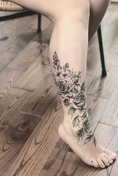 a woman's foot with flowers on it