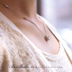 Only pendant necklace: https://www.etsy.com/listing/243617126/120-cttw-classic-halo-pendant-necklace?ref=shop_home_active_10 Matching earrings: https://www.etsy.com/listing/247600444/109-cttw-round-halo-stud-earrings?ref=shop_home_active_1 Our diamond simulants are elegant, unique, and outstanding. The gemstones are cultured from the Czech Republic and handmade at our studios in Garment District and Diamond District in New York City, U.S. They are finished through supremacy cuttings and brillian Timeless Sterling Silver Jewelry For Anniversary, Timeless Sterling Silver Diamond Necklace For Wedding, Elegant Sterling Silver Engraved Diamond Necklace, Elegant Engraved Sterling Silver Diamond Necklace, Delicate Engraved White Gold Jewelry, Silver Engraved Diamond Necklace For Wedding, Fine Jewelry Wedding Necklace With Adjustable Chain, Sterling Silver Round Necklace For Wedding, Delicate Diamond Cut Sterling Silver Necklace