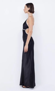 Designed in a flattering silhouette, the BEC + BRIDGE Zariah Halter Dress is cut from a lustrous fabric. The dress features a deep V and a statement halter neckline that ties above an open back. This product is certified Australian made. FIT: Designed to be fitted at the bust and hips, slightly loose in the body of the skirt. Dress is accessed through tie detail at back, not bra friendly. Fabric offers no stretch to the fit. SIZING: True to size, select your normal size Model is 178cm / 5'10 wearing an AU 8 / US 4. Designed + made in Australia FABRIC: 100% viscose CARE: This is an extremely delicate speciality fabric, please take care Dry clean only – please choose your dry cleaner carefully Must not be spot cleaned or encounter any liquids. Bec And Bridge, Bec Bridge, Black Halter Dress, Prom Dress Shopping, Solid & Striped, Brides And Bridesmaids, Halter Neckline, Skirt Dress, Deep V