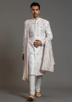 Men White Embroidered Floral Wedding Sherwani Designer custom made White Hand floral fully embroidered jacket style floral sherwani with chudidar in UK . The latest heavy silk embroidered sherwani is best choice for groom . It is suited for Indian and Pakistani wedding wear . #wedding #weddingdress #weddingdresses #sherwani #sherwanidress ##marriagedress #weddingoutfits Sharvani For Men Wedding White, Sherwani Design, Indo Western Outfits For Men, Ivory Sherwani, Embroidery Shirts, Wedding Kurta, Designer Blazers For Men