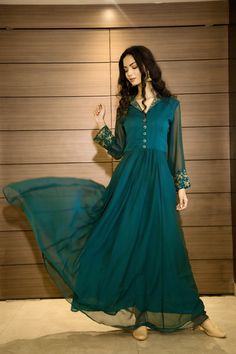 This beautiful teal georgette gown is best for all your upcoming occasions. It is exquisitely embellished with bead work. The fabric we use is of premium quality. Length of this dress is 56. If you need any kind of customizations. You can reach us on Instagram @labeltamannarungta. Embellished Green Georgette Anarkali Set, Embellished Semi-stitched Floor-length Dresses, Hand Embellished Maxi Length Festive Evening Dress, Hand Embellished Maxi Evening Dress For Festive Occasions, Green Floor-length Anarkali Set With Sequins, Festive Hand Embellished Maxi Evening Dress, Green Sequined Georgette Anarkali Set, Elegant Semi-stitched Floor-length Gown, Elegant Embroidered Georgette Maxi Dress