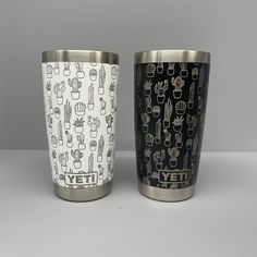 two tumblers with cactus designs on them sitting next to each other in front of a gray background