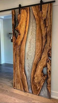 an image of a wooden wall in the middle of a room with wood flooring