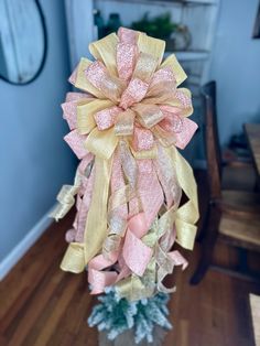 This pink and gold Christmas Tree Topper Bow with long tails features a variety of pink and gold Christmas ribbons. This elegant pink and gold tree topper bow will be the perfect touch for your holiday decorating needs. Whether you use it on your Christmas Tree or wreath it will look will spectacular! Multi-pack bows and wreath bows can also be added to your order. If you don't see what you're looking for or want custom-size loops and tails on your bow, please reach out for a custom order! **Not Pink Rose Tree Topper, Christmas Bow Topper, Sapin Rose, Pink And Gold Christmas Tree, Christmas Tree With Ribbon, Tree With Ribbon, Pink And Gold Christmas, Gold Tree Topper, Gold Christmas Tree Topper