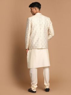 VASTRAMAY Men's Gold Woven Blazer And Cream Solid Kurta With Pajama Set This stylish set features a gold woven blazer paired with a cream solid kurta and pajama. Perfect for festive occasions, weddings, or formal events, this ensemble combines traditional elegance with contemporary flair. Key Features Gold woven blazer with intricate detailing Cream solid kurta with a comfortable fit Matching cream pajama Perfect for festive and formal occasions Specifications Blazer: Single-breasted with button Off White Zari Work Sets For Formal Occasions, Off White Formal Sets With Zari Work, Formal Off-white Sets With Zari Work, Cream Long Sleeve Nehru Jacket For Diwali, Festive Gold Blazer For Semi-formal Occasions, Formal Off-white Sets For Diwali, Festive Semi-formal Gold Blazer, Beige Long Sleeve Semi-formal Set, Festive Gold Semi-formal Blazer