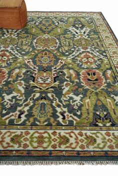 an area rug with a wooden block on the floor