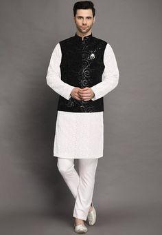 Faux Georgette Kurta in White.This Readymade attire is Enhanced with Buttons, Resham and Sequins Work. Crafted in Chinese Collar Neck and Full SleeveAvailable with Cotton Pant in White and a Velvet Nehru Jacket in BlackDo note: Brooch and Footwear shown in the image is for presentation purposes only. Half to one inch may vary in measurement. (Slight variation in actual color vs. image is possible)  We sell all kinds of menswear. Mens Kurta | Mens Kurta Pajama | Mens Sherwani | Mens Sherwani Sets Fitted White Nehru Jacket For Fall, Festive Black Long Sleeve Nehru Jacket, Traditional Black Outerwear With Chikankari Embroidery, Festive Black Outerwear With Chikankari Embroidery, Festive Black Outerwear With Intricate Embroidery, Traditional Black Outerwear With Floral Embroidery, Black Embroidered Sets For Fall, Embroidered Black Sets For Fall, Traditional Black Nehru Jacket For Winter