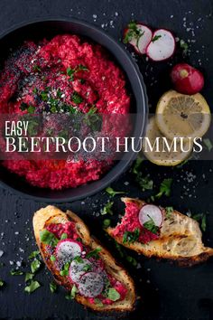 Beetroot hummus in a black bowl with toasted bread and lemon slices on the side. Beetroot Hummus Recipe, Hummus Crackers, Seeded Crackers, Roasted Beet Hummus, Beetroot Hummus, Vegan Dips, Beetroot Recipes, Beet Hummus, Healthy Dips