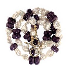 This is part of Chairish’s Fine Jewelry assortment.  24-25 Inch Expandable necklace of creamy white freshwater pearls of interesting shapes and smooth purple Charoite rondelles.  These iridescent pearls juxtapose with the purple Charoite for an elegant fresh look in a pearl necklace. Wear this necklace just because it makes you feel so good. Purple Pearl Jewelry With Gemstone Beads, Purple Pearl Jewelry With Natural Stones, Purple Pearl Single Strand Jewelry, Purple Single Strand Pearl Jewelry, Elegant Single Strand Amethyst Beaded Necklace, Elegant Mother Of Pearl Necklace With Gemstone Beads, Elegant Purple Pearl Bracelet With Round Beads, Handmade Elegant Purple Pearl Bracelet, Elegant Handmade Purple Pearl Bracelet