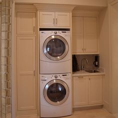 a washer and dryer stacked in a laundry room