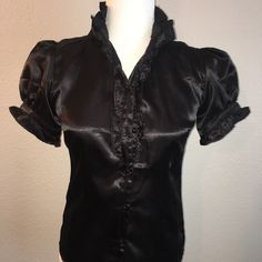 Black Satin Blouse Size Small Or 4 True To Size Perfect New With Tags And Spare Button Button Down Front Tie Short Sleeved Model Is Sz 6 Fitted V-neck Blouse With Buttons, Short Sleeve Party Tops With Buttons, Fitted Short Sleeve Shirt For Night Out, Fitted V-neck Shirt With Button Closure, Fitted V-neck Top With Back Button Closure, Fitted Button Shirt For Night Out, Short Sleeve Party Shirt With Buttons, Fitted Short Sleeve Blouse For Formal Occasions, Party Shirt With Short Sleeves And Buttons