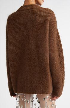 The Danish designer's signature mixture of texture and shape is at its cozy best in this roomy cable-knit sweater made from a rich blend with warm mohair and wool yarns. 27" length (size Medium) Crewneck Long sleeves Ribbed cuffs and hem 38% mohair, 30% wool, 29% polyamide, 3% elastane Dry clean or machine wash, dry flat Imported Designer Clothing Fall Mohair Cable Knit Sweater, Cozy Mohair Sweater With Cable Knit, Cozy Mohair Cable Knit Sweater, Elegant Oversized Cable Knit Sweater, Brown Merino Wool Cable Knit Sweater, Oversized Mohair Cable Knit Sweater, Oversized Cable Knit Cashmere Sweater, Cozy Alpaca Cable Knit Sweater, Elegant Brown Cable Knit Sweater