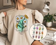 Custom Birth Month Flower Sweatshirt, Flower Sweatshirt, Personalized Flower Sweater, Birthday Month Shirt, Birthday Shirt, Mothers Day Gift Welcome to AuroraConceptDesign! ❤️ 👉🏻 PROCESSING TIME: - 3-5 business days. - Please contact us if there is a rush order. 👉🏻 DELIVERY TIME: - Standard Shipping:  3-5 business days - Expedited Shipping  1-3 business days 👉🏻 CARE INSTRUCTIONS: - Machine wash cold and tumble dry low.  - Do not iron directly onto the design. - Do not bleach. We offer a wide variety of products, including Unisex T-shirts, Women's V-neck T-shirts, Unisex Long Sleeve T-shirts, Youth T-shirts, Toddler T-shirts, and many more. Swipe listing images and check all the colors available for each type of shirt. Please enter the shirt and text color desired for your shirt in th Spring Crew Neck Sweatshirt For Gift, Spring Crew Neck Sweatshirt, Crew Neck Sweatshirt For Spring, Mother's Day Birthday Graphic Print Sweatshirt, Graphic Print Sweatshirt For Birthday And Mother's Day, Spring Cotton Sweatshirt Gift, Spring Birthday Custom Print Tops, Spring Gift Long Sleeve Sweatshirt, Spring Cotton Sweatshirt With Custom Print