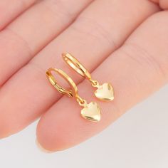 "Title: Puffy Heart Earrings Product Description: Materials & Finish: * 14k Gold Filled over Brass * Waterproof / Hypoallergenic / Lead & Nickel Free Size Specs: * Dangle Chain Length for Maxi Earrings: 1.15\" * Hoop Size: 12mm * Pendant Dimensions: 7mm x 8.5mm Features: * The petite heart design * Handmade with love and attention to detail * All items are packaged in pouch, inside of a high quality and luxurious ready to gift box. * You can find more info on materials, size guide, and jewelry care on the card inside of the package. How to Order:    1- Explore our Collection    2- Select Your Favorites: Once you've found your favorite pieces, click on the product to view detailed information. Select your preferred options, such as metal /material type, gemstone, size, chain type , chain le Pierced Huggie Earrings For Valentine's Day, Dainty Hoop Earrings For Valentine's Day, Hypoallergenic Drop Earrings For Valentine's Day, Elegant Heart Charm Huggie Earrings For Valentine's Day, Dainty Pierced Hoop Earrings For Valentine's Day, Elegant Dangle Huggie Earrings For Valentine's Day, Minimalist Tarnish-resistant Heart Earrings As Gift, Gold Plated Earrings For Valentine's Day Gift, Dainty Gold Plated Heart Earrings