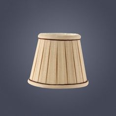 a wooden lamp shade on a gray background