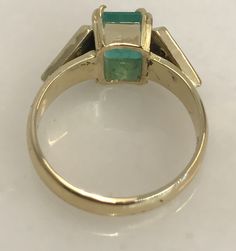 Here is a beautiful 14k yellow gold ring set with a 7 x 5mm emerald and six round diamonds. Such a lovely ring to wear on your right hand or even as an engagement ring! Metal: 14k yellow gold Stones: 1-EM 7x5mm, 6-RB .18cttw. Finger Size: 6.5 (please contact us if you need another size) Weight: 4.6 grams SKU# 21SB063318AIX If you have any questions on this item, please message us! GandDJewelers.etsy.com Please note that all of our pieces have been analyzed & identified by a Gemological Insti Emerald Diamond Ring, Gold Ring Sets, Lovely Ring, Ring Metal, Yellow Gold Ring, Multi Stone Ring, Emerald Diamond, Yellow Gold Rings, Right Hand