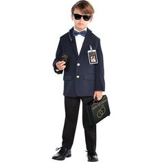 a young boy dressed in a suit and tie with sunglasses on his head, holding two briefcases