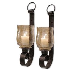 two wall sconces with candle holders attached to the back of each one,