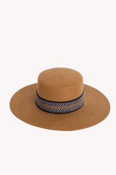 Handcrafted in Peru and Bolivia, these alpaca and sheep wool blend hats are durable and offer full sun-protection for your everyday activities. The unisex Spanish Style Hat is a traditional “Bolero and Spanish Style” hat with a removable Quechua textile intention band. You choose your own intention band. Available in sizes S, M, L & XL for men and women. 50% alpaca and 50% wool felt, 50% alpaca and 50% wool accent, cotton/polyester cinch Dry clean only Textile softness: Soft - this item has been Brown Wide Brim Boater Hat For Winter, Brown Flat Crown Boater Hat For Winter, Bohemian Wide Brim Wool Felt Hat, Adjustable Alpaca Hat For Outdoor, Adjustable Bohemian Wool Hat, Bohemian Wool Felt Hat With Short Brim, Bohemian Wool Hat Bands For Brimmed Hats, Bohemian Wool Brimmed Hat Bands, Bohemian Wool Hat With Flat Brim