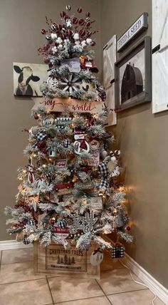 a decorated christmas tree in the corner of a room