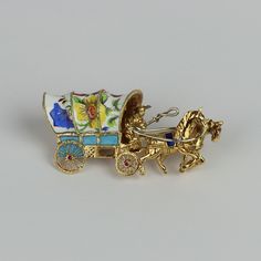 PURCHASE WITH CONFIDENCE Safe FREE Shipping 14 Day Returns Everything 100% Guaranteed! Find More Like This Description Payment Shipping Returns About Us Contact Us Vintage 18k Yellow Gold, Ruby, Enamel Horse & Covered Wagon Brooch Pin Gender Women Material Gold Metal Purity 18k Main Stone Ruby Quality Quality Guidelines New: Straight from the factory. Excellent: Previously-owned estate piece, unused or lightly used. May be tarnished because of age. May also be described as "unused" or "like new". Very Good: Shows signs of gentle use. No wear, damage, or repair. May have minor hairline scratches/nicks consistent with light use. Good: Shows moderate use. Wear and/or imperfections may be present and will be stated in description. Fair: Items will be well worn. Patterns will show wear. Signs o Luxury Gold Enamel Brooch, Luxury Gold Enamel Brooches, Yellow Gold Enamel Brooches Hallmarked, Yellow Gold Enamel Brooches For Gifts, Yellow Gold Enamel Pin Collectible, Hallmarked Enamel Brooches As Gifts, Hallmarked Enamel Brooches For Gifts, Gift Enamel Brooches Hallmarked, Ornate Enamel Brooches For Gifts