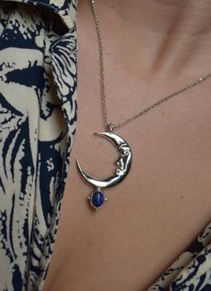 In the Ancient mythology Zirna was an Etruscan goddess of the waxing moon. The moon is the symbol of the soul, the closet celestial body of the planet Earth. This is a sculptural pendant, carved in wax, casted in Sterling silver, set with a beautiful Lapis Lazuli gemstone & polished to a beautiful burnished silver finish. It is harmonized with a high quality long silver cable chain. Circumference is 42 cm. Looks great layered on it's own but do not hesitate to pair it with other chain necklaces Celestial Crescent Moon Phase Necklace, Celestial Moon-shaped Jewelry For Meditation, Celestial Moon Jewelry For Meditation, Bohemian Sterling Silver Moon Phase Necklace, Bohemian Moon Phase Necklace In Sterling Silver, Celestial Sterling Silver Jewelry For Meditation, Celestial Style Necklace With Moon Charm, Celestial Crescent Jewelry For Meditation, Sterling Silver Celestial Jewelry For Meditation