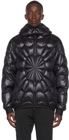 Down-filled nylon satin jacket. Graphic pattern quilted throughout. · Logo bonded at hood · Zip closure · Zip pockets · Signature tricolor felted logo patch at sleeve · Rib knit hood, cuffs, and hem · Nylon satin lining · Logo-engraved black hardware Supplier color: Black Fill: 90% down, 10% feathers. | Moncler Black Spider Down Jacket Moncler Spider Jacket, Satin Jacket, Black Spider, Knitted Hood, Satin Jackets, Black Hardware, Graphic Patterns, Tri Color, Luxury Streetwear