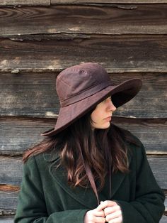 The 'Storm Chaser' is based on the traditional form of collapsible Waxed Cotton Sou'westa rain hat that is longer in the back than the front to protect the neck fully. The hat has a roll up brim at the front which works like a gutter whilst keeping the face clear. The brim extends down the back, bridging and protecting the neck.  The 'Storm Chaser' is the perfect choice for women who have to be out in the worst weather but want to be looking their best.  Because the brim is large there are added Curved Brim Hats For Fall Outdoor Activities, Fall Hats With Curved Brim For Outdoor Activities, Adjustable Waterproof Sun Hat With Curved Brim, Waterproof Adjustable Sun Hat With Curved Brim, Outdoor Fall Hat With Curved Brim, Waterproof Solid Color Wide Brim Sun Hat, Adjustable Hats For Outdoor Activities In Fall, Wide Brim Hats For Outdoor Activities In Fall, Brown Curved Brim Sun Hat For Outdoor