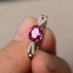 This is a gorgeous handmade creation. Its beauty is its simplicity & Elegance. The 6*8 mm oval shape faceted lab Ruby is crafted in solid sterling silver and with rhodium plated. Main stone weight about 1.75 ct. CZ as accents. All item is sent in a beautiful gift box If you have any idea of design your ring,pls contact me directly. You can realize more lovely stuff clicking the link https://www.etsy.com/shop/knightjewelry?refshopsection_shophome_leftnav Please leave the correct address and y Wedding Rings Oval Cut, Rings Ruby, Garnet Wedding Rings, Star Ruby Ring, Rings Oval, Ruby Wedding Rings, Swiss Blue Topaz Ring, January Birthstone Rings, Red Stone Ring