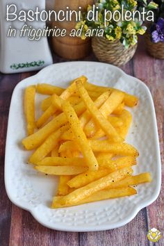 some french fries on a white plate