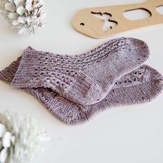 The Bliss Lace Knit Socks Pattern combines the elegant single eyelet rib stitch with a stockinette sole. The result is a stunning pair of cozy socks that will keep your toes blissfully warm in the cooler months! Materials: US size 1 (2.25 mm) circular knitting needles (min 32” cord for magic loop method), or double pointed knitting needles. Knit Picks Stroll Tweed fingering weight sock yarn in Lavender Field Heather. Socks in photo are for size 9 feet and required just under 1 skein (230 yards) for two socks. Scissors. Stitch marker. Tapestry/yarn needle. Size: Width is for a typical Adult Female Foot. Length of foot can be customized in pattern. Skill Level: Intermediate Knitting Patterns Lace, Knit Socks Pattern, Leg Warmers Knitting Pattern, Knit Leg Warmers Pattern, Socks Knitting Pattern, Crochet Washcloth Pattern, Double Pointed Knitting Needles, Socks Knitting, Washcloth Pattern