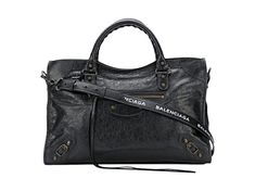 This classic city bag from Balenciaga is masterfully crafted from black agneau leather with handwoven whipstitch details. Versatile in design, this bag features rolled top handles along with a detachable leather shoulder strap. The tasseled top zippers open to a spacious interior lined with black fabric. Look no further for a classic luxury handbag with exquisite signature details from Balenciaga.    Model : 505550  Black Agneau leather  Handwoven whipstitch detail  Zipper closure    Aged brass Designer Black Bag With Rolled Handles, Designer Black Bags With Rolled Handles, Luxury Black Satchel With Rolled Handles, Designer Black Shoulder Bag With Rolled Handles, Designer Shoulder Bag With Rolled Handles, Aged Brass Hardware, Balenciaga Model, Balenciaga Classic City, School Trends