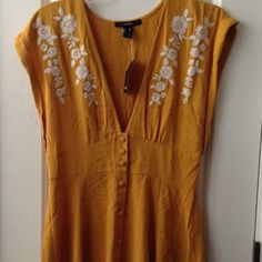 Forever 21 Floral Embroidered Woven Dress In Mustard/Cream, Size Medium *New With Tags *Size Medium *Mustard Yellow And Cream Embroidered Floral Design *Deep V-Neck *Sleeveless Deep V-Shoulder Arm *Button Up Mustard Yellow Fabric Buttons *Non-Lined Skirt *Knee-Length Skirt *Materials: Rayon, Polyester *Original Retail Msrp: $30 *Buy It Now: $14 Yellow Embroidered V-neck Dress, Casual Yellow Dresses With Floral Embroidery, Casual Yellow Dress With Floral Embroidery, Forever 21 Yellow Dress For Brunch, Yellow Forever 21 Dress For Brunch, Forever 21 Sleeveless Yellow Dress, Forever 21 Yellow Sleeveless Dress, Black Sparkly Dress, Sleeveless Sweater Dress