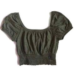 Olive Green Eyelet Crop Top Size Small New With Tags! Measurements Are Approximate And Taken Flat Bust: 15” Sleeve: 8” Length: 10.5” Waist: 11-14” Green Cotton Smocked Top For Summer, Summer Peasant Top With Smocked Cuffs, Casual Peasant Top With Puff Sleeves And Smocked Back, Casual Green Smocked Top For Beach, Green Summer Blouse With Smocked Cuffs, Summer Green Blouse With Smocked Cuffs, Spring Casual Peasant Top With Elastic Neckline, Casual Cropped Smocked Top, Casual Peasant Top With Smocked Bodice And Puff Sleeves