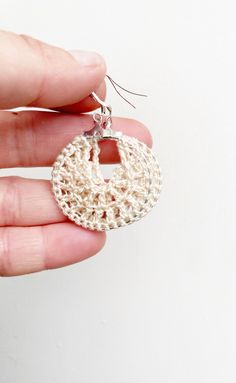 Crochet cream hoop earrings ! These beautiful crochet earrings are stunning and unique! Perfect as a gift for her for valentines or any other occasion!  There are 2 sizes to choose from:  Large hoops are 4cm  Small hoops are 2cm All my earrings are made with 925 stamped sterling silver earring hooks.  While every effort is made to maintain true colours in my listings, due to the nature of screen monitors, colours may be slightly different.  Care instructions: Please store in a cool dry place Take care with water as my earrings are water resistant but not waterproof  Free shipping  All earrings are handmade by me, in the sunshine state of Queensland! I hope you love your Jhoomka as much as I have making them! Handmade Beige Earrings For Gift, Handmade Beige Dangle Jewelry, Handmade Bohemian Cream Earrings, Beige Handmade Dangle Jewelry, Handmade Cream Bohemian Earrings, Round Crochet Jewelry As Gift, Handmade Beige Drop Earrings, Cream Bohemian Earrings As A Gift, Cream Bohemian Earrings As Gift