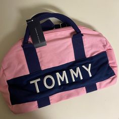 It’s New Not Used. Tommy Hilfiger Boys' And Girls' Bag. 14.5" (L) X 8" (W) X 8" (H). 100% Cotton. Trendy Pink Shoulder Bag With Logo, Trendy Satchel Duffle Bag For School, Casual On-the-go Bags With Logo, Trendy Rectangular Duffle Bag For School, Pink Tote Bag For Back To School, Back To School Pink Tote Bag, Preppy Pink Bag For Daily Use, Sporty Pink Shoulder Bag For School, Trendy Pink Duffle Bag For On-the-go