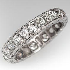 This elegant circa 1930s eternity band is accented with twenty-two (22), bead set, old European cut diamonds and bordered with milgrain edging. The band measures 4.7mm wide and 2.5mm thick. This ring is a size 8.75 and cannot be resized due to the design. Three of the diamonds have chips. Classic Platinum Jewelry With Decorative Band, Decorative Diamond Band With Round Cut, Heirloom Eternity Band With Brilliant Cut, Round Diamond Eternity Band With Decorative Design, Luxury Milgrain Platinum Jewelry, Classic Round Cut Jewelry With Decorative Band, Heirloom Diamond Eternity Band For Formal Events, Heirloom Diamond Eternity Band For Formal Occasions, Classic Jewelry With Round Cut Decorative Band