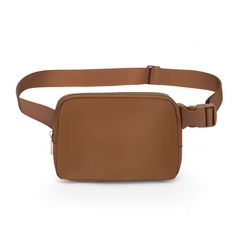 a tan leather belt bag on a white background