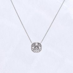 Metal: 925 Sterling Silver Stone: Round Cut (4.25mm and 2.8mm) Stone Carat Weight: 0.52 ct Overall Dimension: 11mm(D) Max Chain Length: 18 in Adjustable Lobster Claw Closure: 16 in, 17 in, 18 in Timeless Silver Round Cut Diamond Necklace, Timeless Silver Diamond Necklace With Round Cut, Silver Round Cut Diamond Necklace Timeless Style, Classic Silver Diamond Necklace With Single Cut Diamonds, Classic Diamond Necklace With Round Halo Pendant, Classic Diamond Necklace With Halo Setting, Timeless Silver Round Diamond Necklace, Luxury Silver Solitaire Necklace With Round Shape, Silver Diamond Necklace With Halo Setting In Sterling Silver