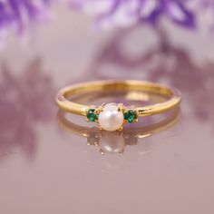 Freshwater Pearl Emerald Ring, 14K Solid Gold Ring, Engagement Ring, June birthstone, Three stone Ring, Anniversary Gift For Women's Jewelry Main Stone: Fresh Water Pearl Main Stone Color: White Main Stone Shape: Round Main Stone Size: 5mm Birthstone Month: June Second Stone: Emerald Stone Shape: Round Stone Color: Green Jewelry Type: Ring Metal: Silver Method: Cast Personalization: Possible Style: Chevron Ring Size: We make rings from US 3 to US 10. This elegant ring is perfect for any occasion Yellow Gold Pearl Birthstone Ring For Promise, Yellow Gold Pearl Promise Ring With Birthstone, Emerald Multi-stone Birthstone Ring Gift, Dainty Opal Anniversary Ring With Birthstone, Dainty Opal Anniversary Ring, Heirloom Style May Birthstone Ring With Prong Setting, Fine Jewelry 14k Gold Birthstone Pearl Ring, 14k Gold Pearl Birthstone Ring Fine Jewelry, 14k Gold Multi-stone May Birthstone Ring