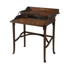 an old wooden desk with writing on it's top and drawer at the bottom