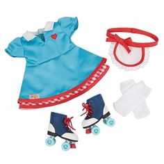 the doll is wearing a blue dress with red trims and has two pairs of roller skates