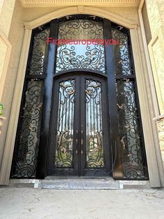 an ornate iron door is shown in front of a building with the word freeformopia on it