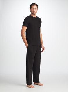 The ideal loungewear companion, the black trouser fastens with an elastic and tie waistband for a winning combination of comfort and flattering fit. The two front side pockets and a rear back pocket help to keep your phone and essentials close while you're lounging, while the black colour makes them easy to pair with our matching lounge t-shirts and hoodies. Our Basel fabric has to be touched to be believed. It offers long-lasting softness and doesn't pill, making it able to withstand countless Black Lounging Pants Full Length, Black Straight Leg Sweatpants For Lounging, Black Wide Leg Pants For Lounging, Black Pants With Straight Hem For Loungewear, Black Loungewear Pants With Straight Hem, Black Lounge Pants With Side Pockets, Black Loungewear Pants With Side Pockets, Black Sweatpants With Straight Hem For Work, Black Sweatpants With Side Pockets For Loungewear