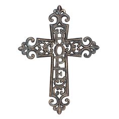 an ornate metal cross on a white background